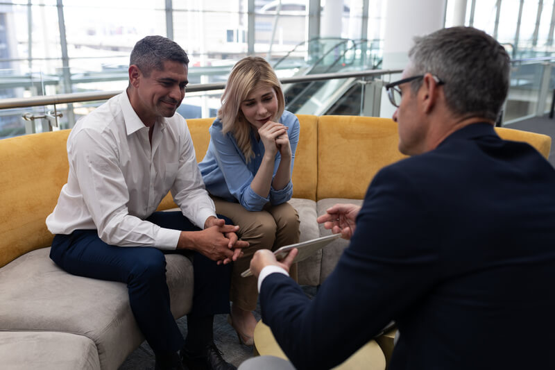 business-people-discussing-over-digital-tablet-sit-2023-11-27-04-56-04-utc (1) (1)