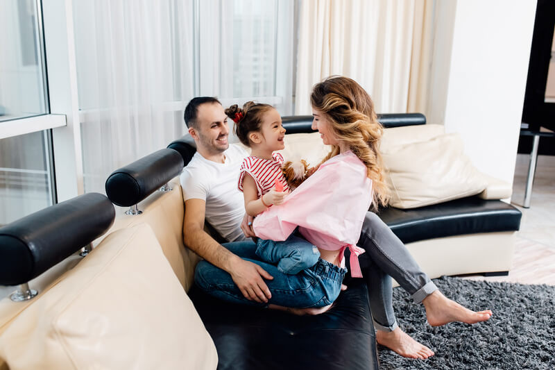 happy-parents-and-kid-having-fun-tickling-sitting-2024-10-20-22-31-15-utc (1) (1)